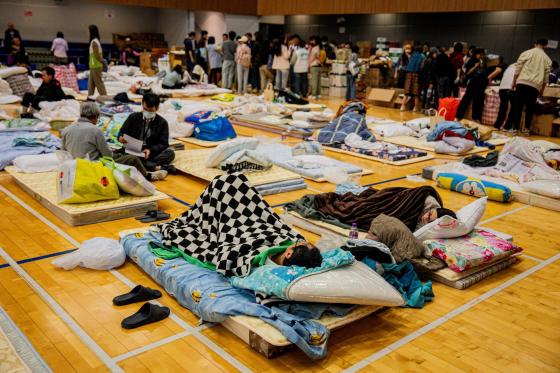 People affected by the apartment fire in the Tai Po district rest at an emergency shelter, Hong Kong, China, 27 November 2025. The fire, which started on 26 November, has killed at least 44 people, and left 279 missing.