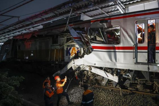 Rescuers work to evacuate trapped passangers from the wreckage of collided trains at the East Bekasi train station in Bekasi, West Java, Indonesia, 27 April 2026. 